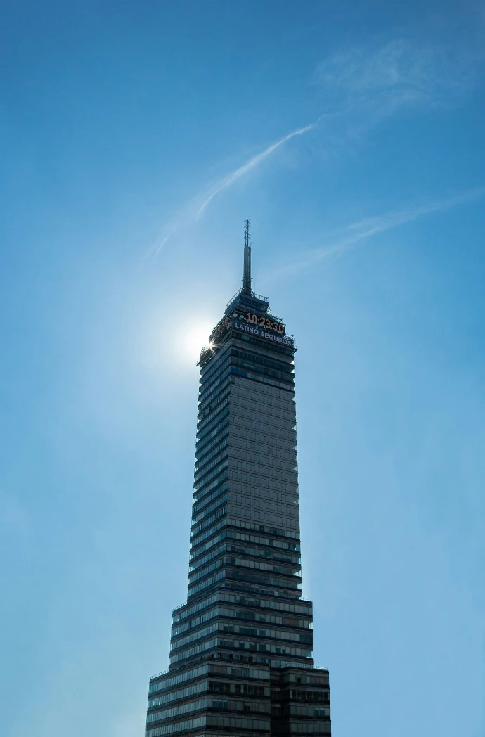 a very tall building with a sky background